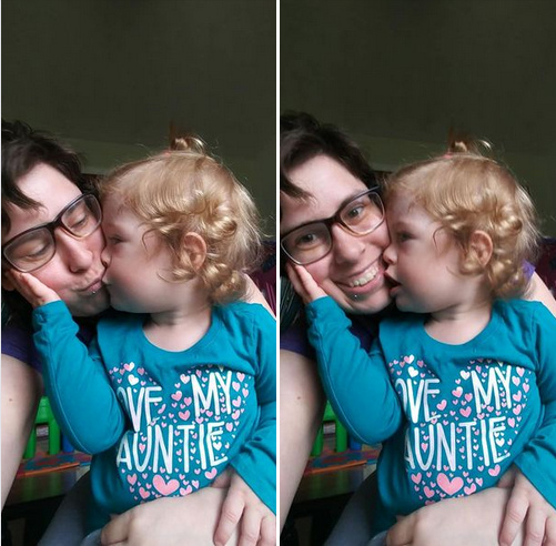 A toddler kisses her aunt